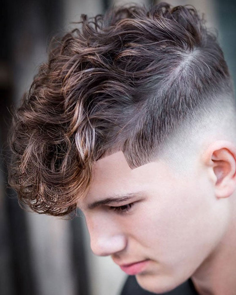 men fade haircuts low bald fade with curly fringe Luxe Digital