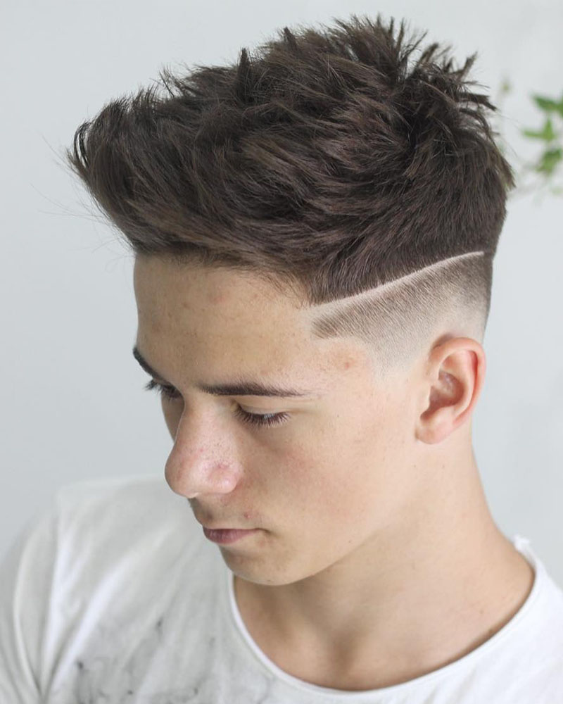 men fade haircuts undercut fade with hard part and textured spikes Luxe Digital