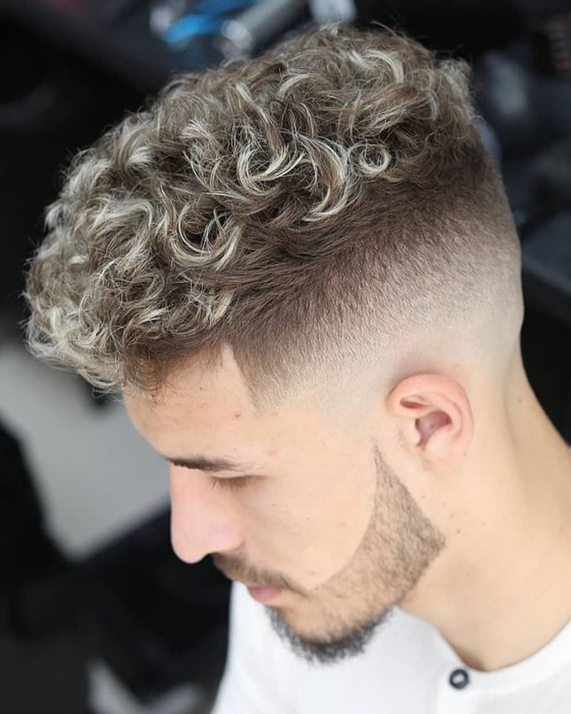 men curly hairstyles highlighted curl with high fade top Luxe Digital