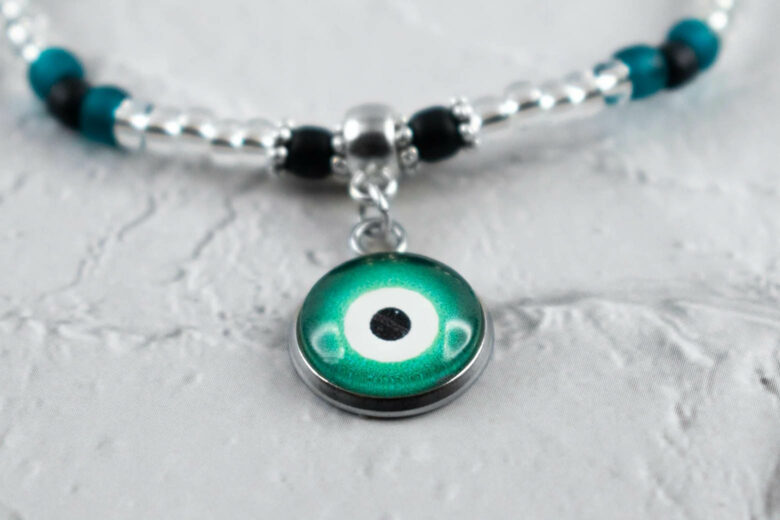 evil eye jewelry meaning dark green evil eye - Luxe Digital