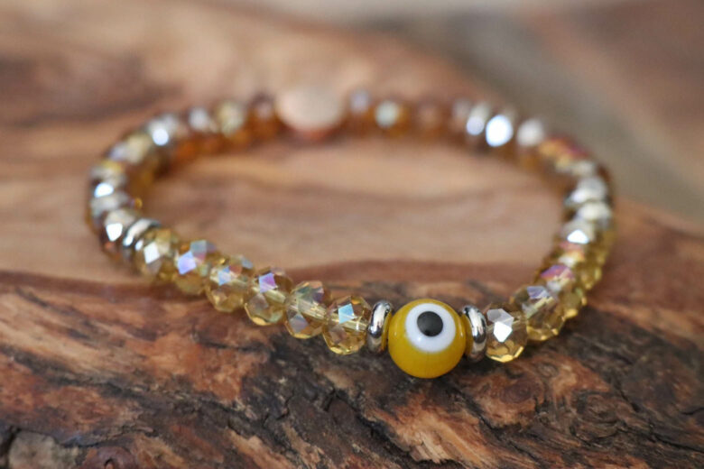 evil eye jewelry meaning yellow evil eye - Luxe Digital