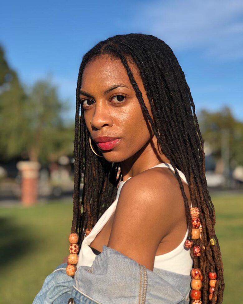 women dreadlock hairstyles thick dreads with beads or strings - Luxe Digital