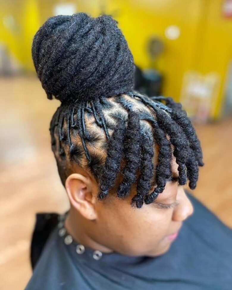 women dreadlock hairstyles very high bun with dreaded bangs - Luxe Digital