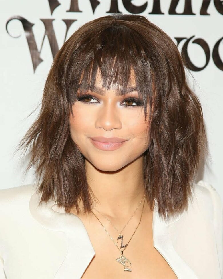 medium haircuts wavy with bangs - Luxe Digital